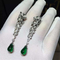 C Cheetah Earrings - showing the charm of courage, naughty or docile .310 round bright cut diamonds, emerald and onyx.